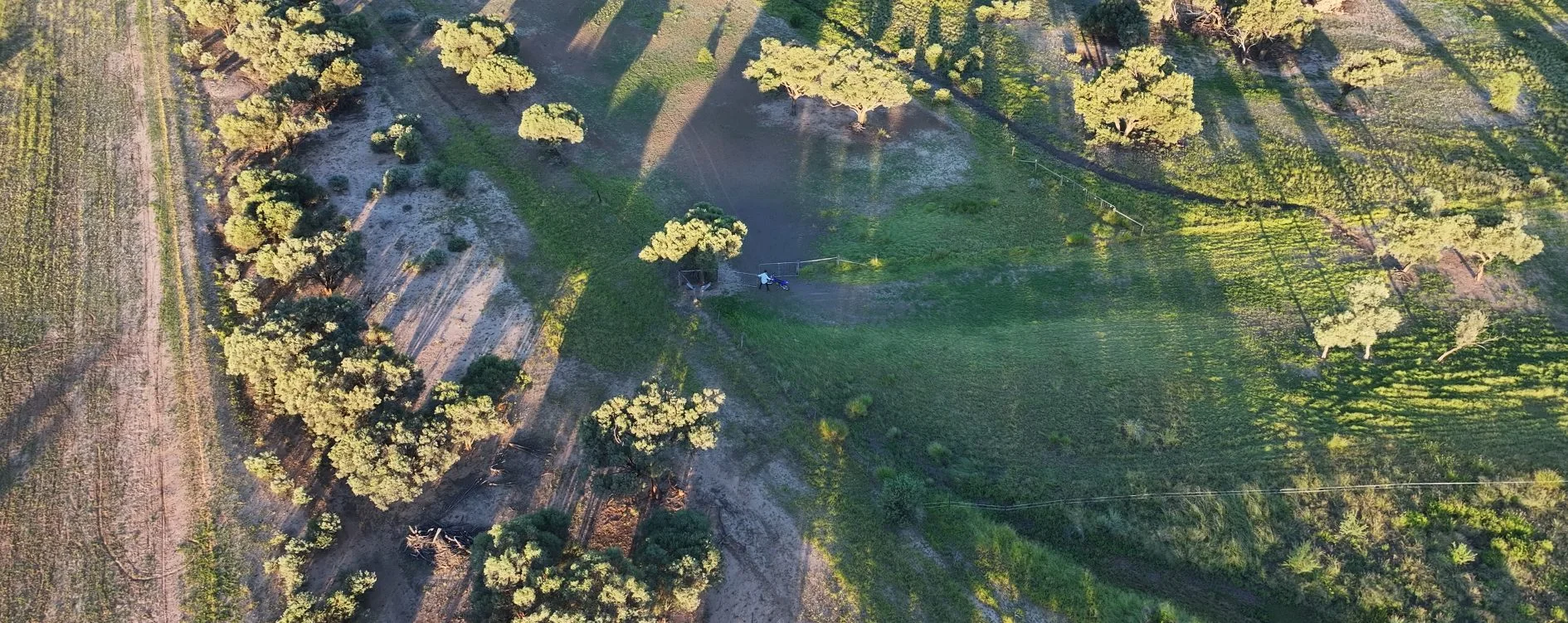 Wide aerial view of monitored rural property